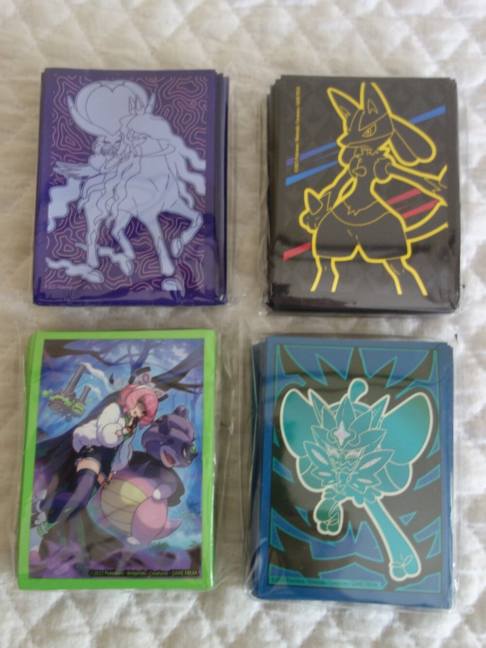 (k)	Lot of 4 NIP 65 count ea POKEMAN Trading Card Sleeves